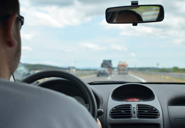 istock Man driving in a traffic jam 858222784