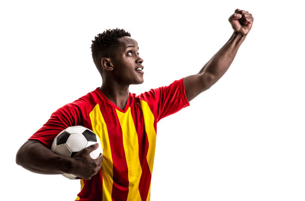 istock Fan / Sport Player on red and yellow uniform celebrating on white background 858225920