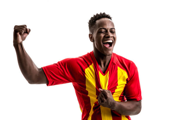istock Fan / Sport Player on red and yellow uniform celebrating on white background 858225944
