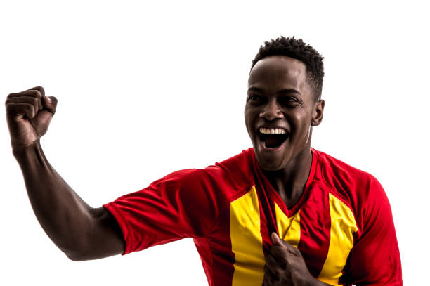 istock Fan / Sport Player on red and yellow uniform celebrating on white background 858225948