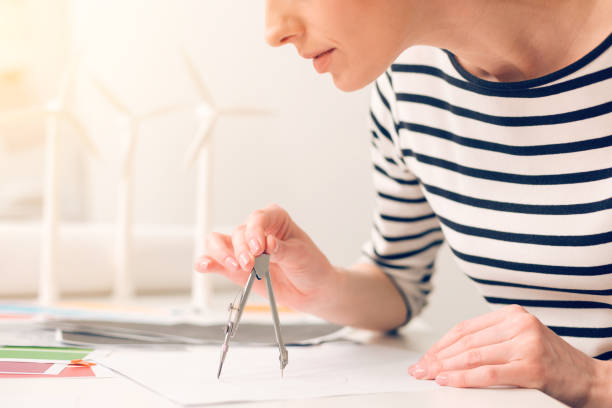 istock Close up of a pair of compasses being in use 858229352