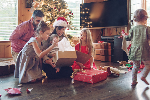 Family decorating the christmas tree