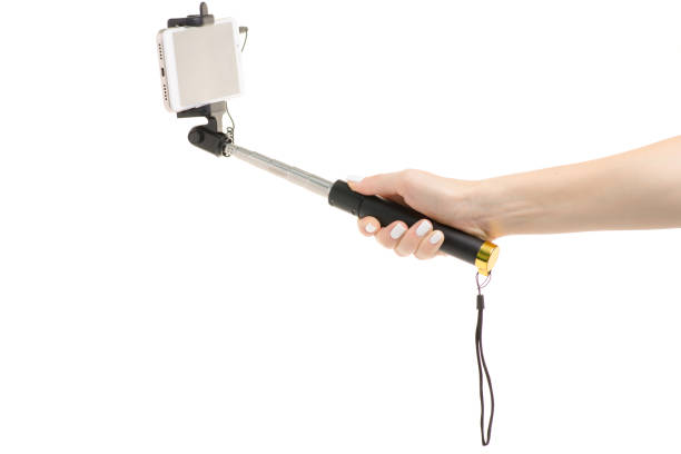 istock Smartphone and selfie stick in hand 858232396