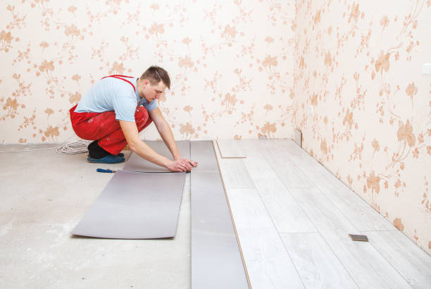 istock handyman laying down laminate flooring boards 858235776