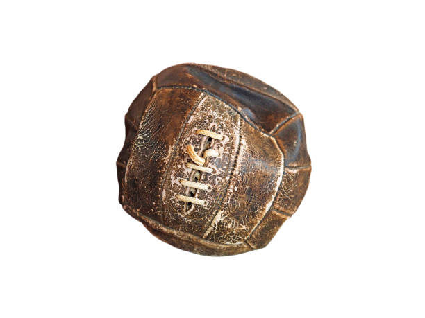 istock Ancient leather soccer ball with white lacing isolated on white background 858237038