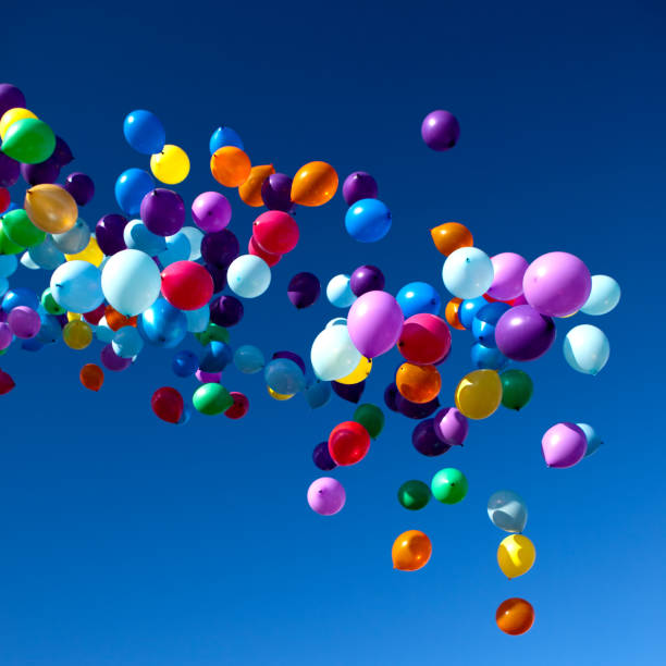 istock Colorful Balloons flying in the sky party 858240316