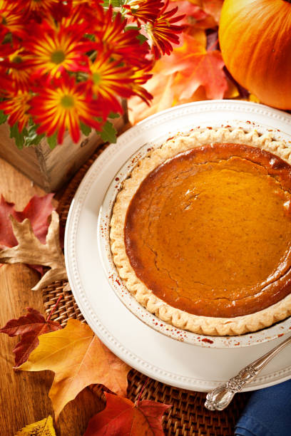istock Autumn Pumpkin Pie Still Life for Thanksgiving Dinner 858243040