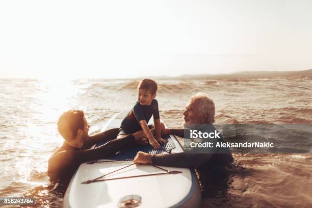Surfing Family Stock Photo - Download Image Now - Multi-Generation Family, Father, Grandfather