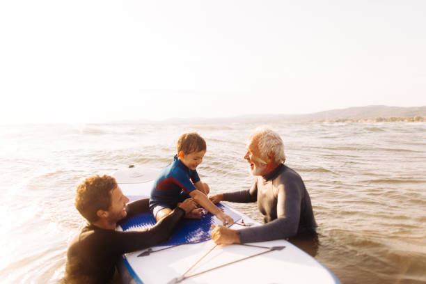 istock Surfing family 858243812