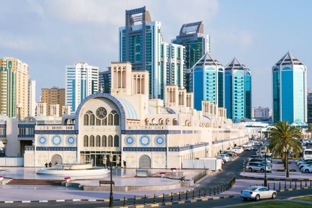 Sharjah downtown skyline Sharjah downtown, with the Central Souq in the foreground and downton's skyscrapers in the background, shoot in the afternoon sharjah city stock pictures, royalty-free photos & images