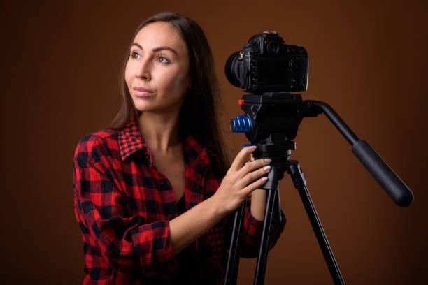 istock Studio shot of young beautiful woman getting ready for vlogging against colored background 858247868