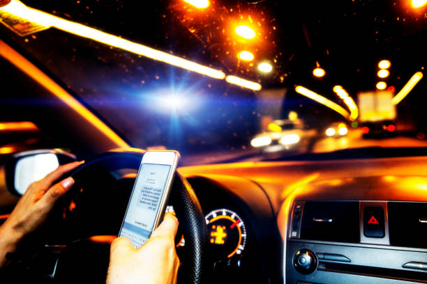 istock Driving a car and texting on a smart phone 858248162