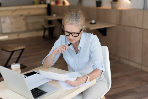 istock businesswoman working in cafe 858248556