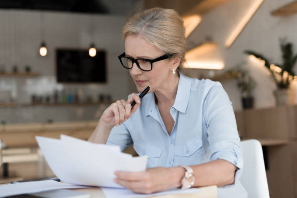 istock businesswoman working with papers 858249010