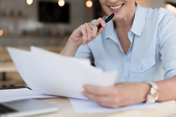istock businesswoman working with papers 858251880