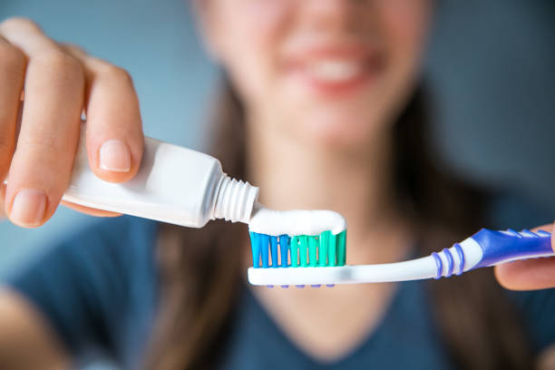 Brushing Teeth Woman, Toothbrush, Toothpaste, scrub, closeup, horizontal, background toothbrush stock pictures, royalty-free photos & images