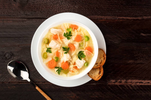 istock Chicken soup with noodles, overhead photo with copyspace 858252724