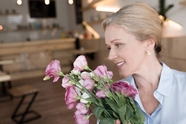 istock mature woman with flowers 858253672