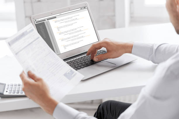istock businessman with laptop computer working at office 858253838
