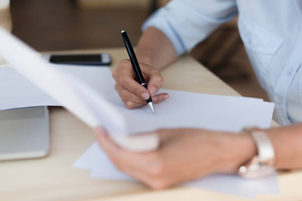 istock businesswoman working with papers 858253876