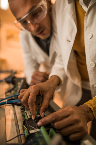 istock Close up of unrecognizable engineer adjusting speed on a machine. 858256428