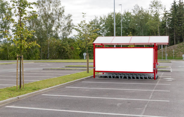 istock Mock up. Shopping carts return point on a parking lot. 858257694
