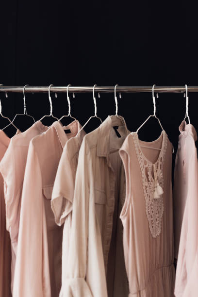 istock clothing hanging on clothes rack 858259796