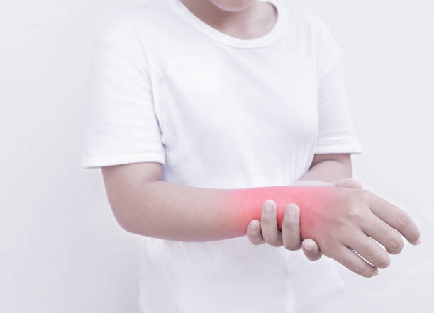 istock Young woman has pain in wrist 858259928