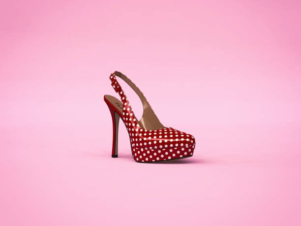 istock Red shoes with white dots on pink background 858259958