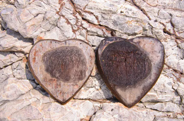 Heart-shaped coconut shell on the rock