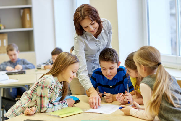 istock group of school kids writing test in classroom 858267400