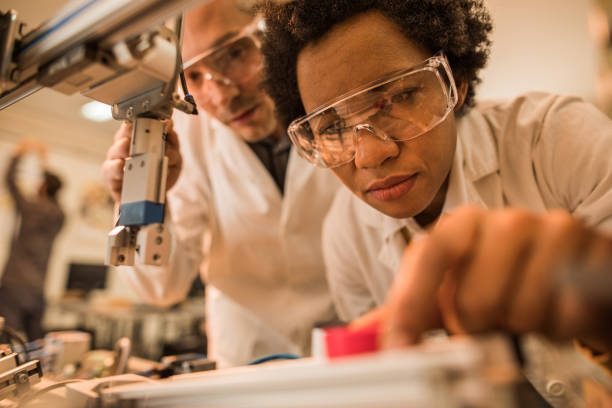 istock Close up of African American scientist testing a machine in laboratory. 858267510