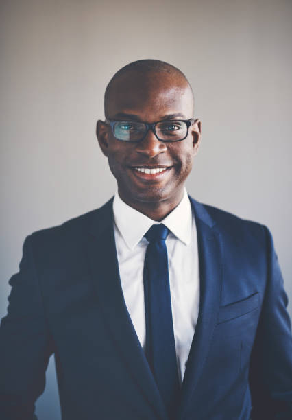 istock Smiling young African executive wearing a suit and glasses 858269282