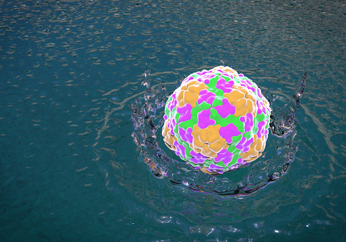 Waterborne viruses, conceptual image. 3D illustration showing Hepatitis A virus dropped into water