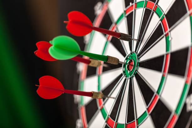 Dartboard. Darts in bulls-eye close up, purpose concept dart stock pictures, royalty-free photos & images