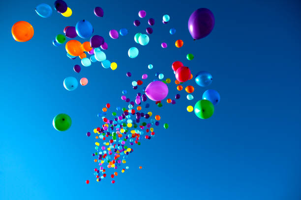 istock Colorful Balloons flying in the sky party 858272402