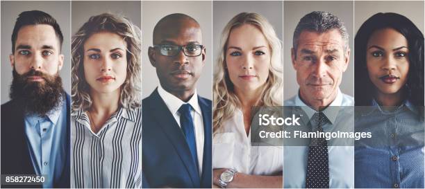 Focused Group Of Ethnically Diverse Professional Businessmen And Businesswomen Stock Photo - Download Image Now