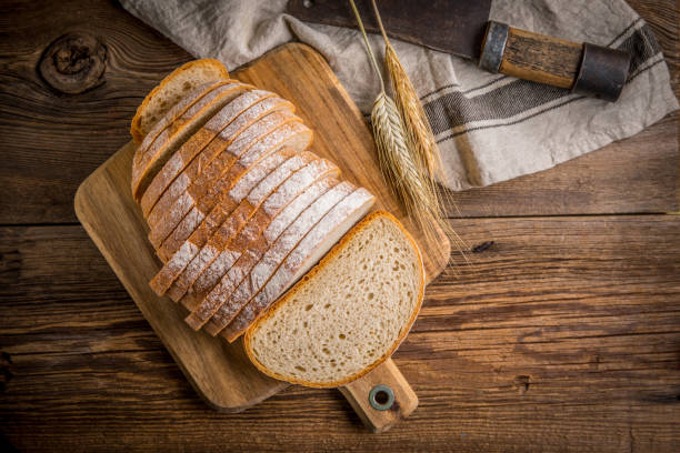 istock Sliced loaf of bread on a chopping board. 858276192