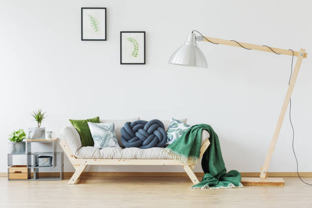 istock Wooden couch and green blanket 858282576