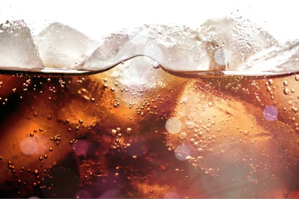 Soda. Ice cubes in cola beverage, close up cola photos stock pictures, royalty-free photos & images