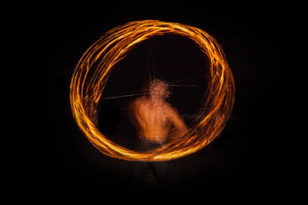 istock Spin the fire Night show,  Spin Fire show on the beach Thailand 858285738