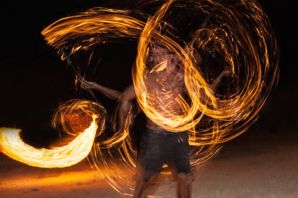 istock Spin the fire Night show, Spin Fire show  on the beach Thailand 858285794