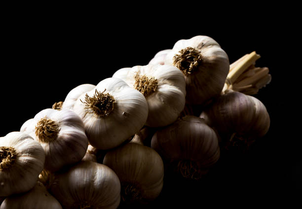 A bunch of garlic on the black background