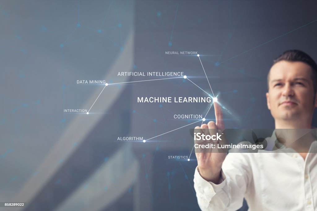 Understanding artificial intelligence. Knowledge of artificial intelligence. Man pressing machine learning sign on virtual touch screen. Machine Learning Stock Photo