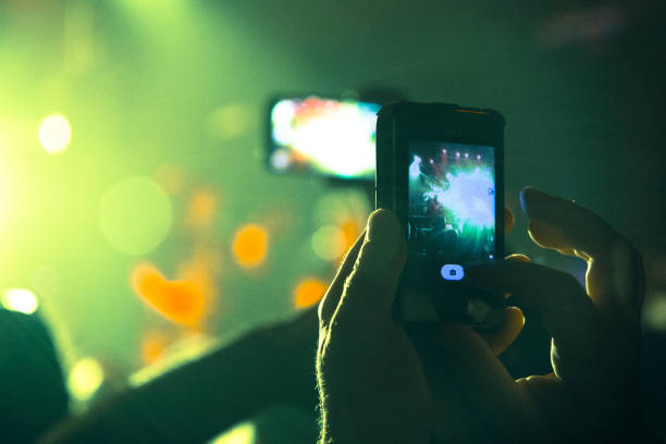 istock Close up on smart phones at a concert 858292870
