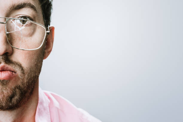 man with broken eyeglasses - broken glasses imagens e fotografias de stock