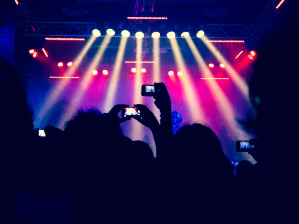 istock Concert crowd filming a live stage 858293418