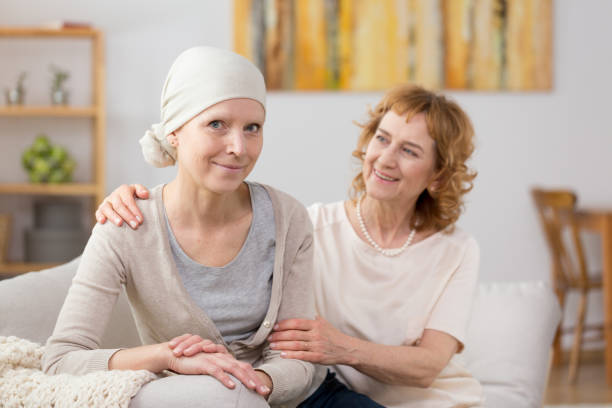 istock Cancer survivor sitting on couch 858303138