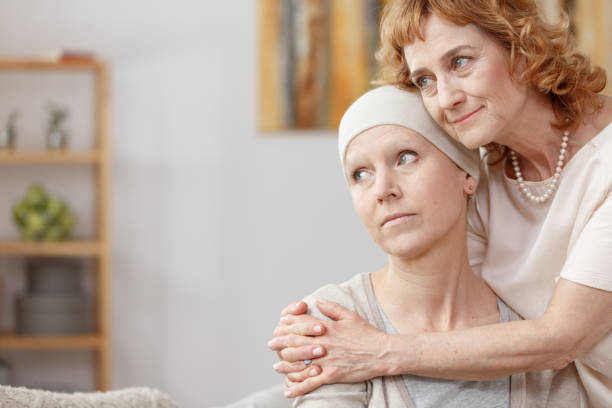 istock Tumour patient comforted by friend 858303206