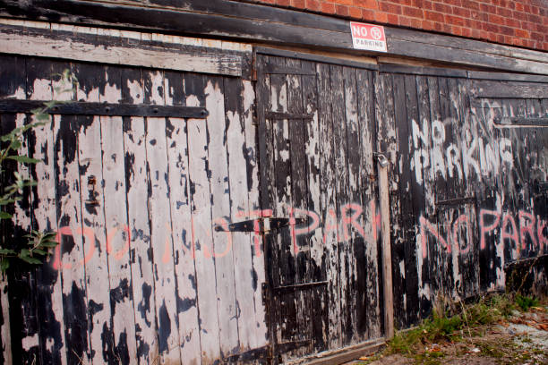 istock No parking writing on a wooden door uk 858305624
